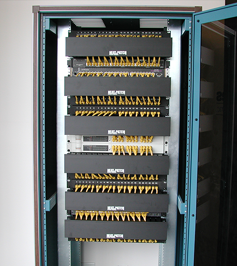 High-density data cabinet with NEAT-PATCH cable managers for clean, organized cable routing