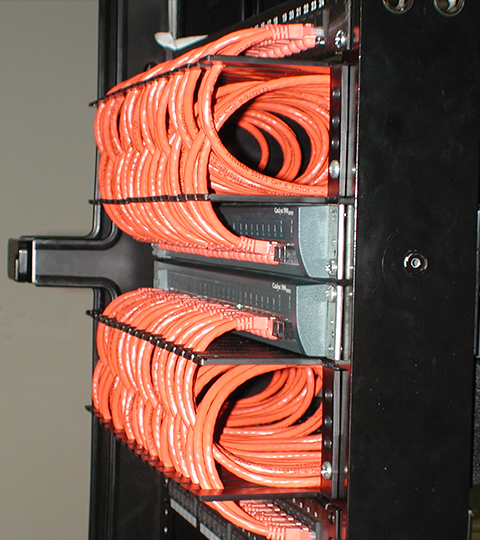 NEAT-PATCH cable management system showing uniform cable routing with proper bend radius control