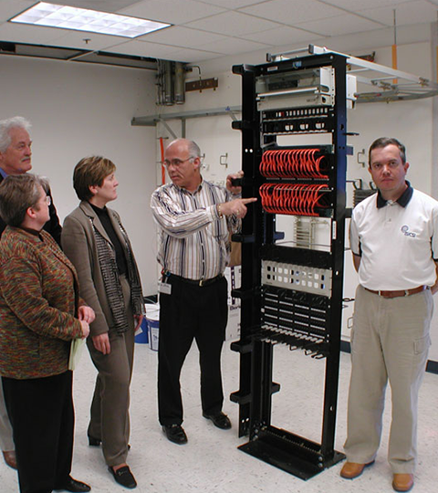 Bruce Nardone of BICSI demonstrating NEAT-PATCH cable management benefits in a BICSI training classroom
